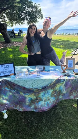 Free chair massage being given at a Tuesday Park Days event